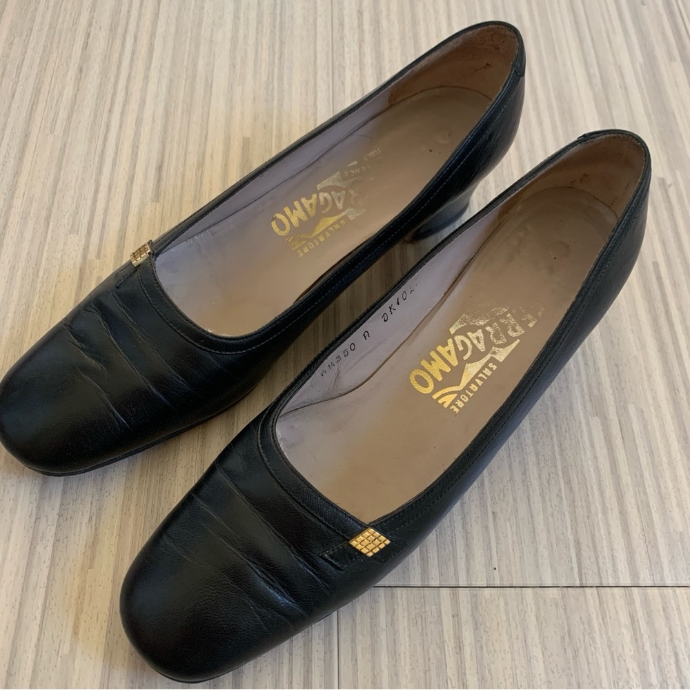 Salvatore Ferragamo Pumps / Heels in Black accented with a gold Diamond size 7